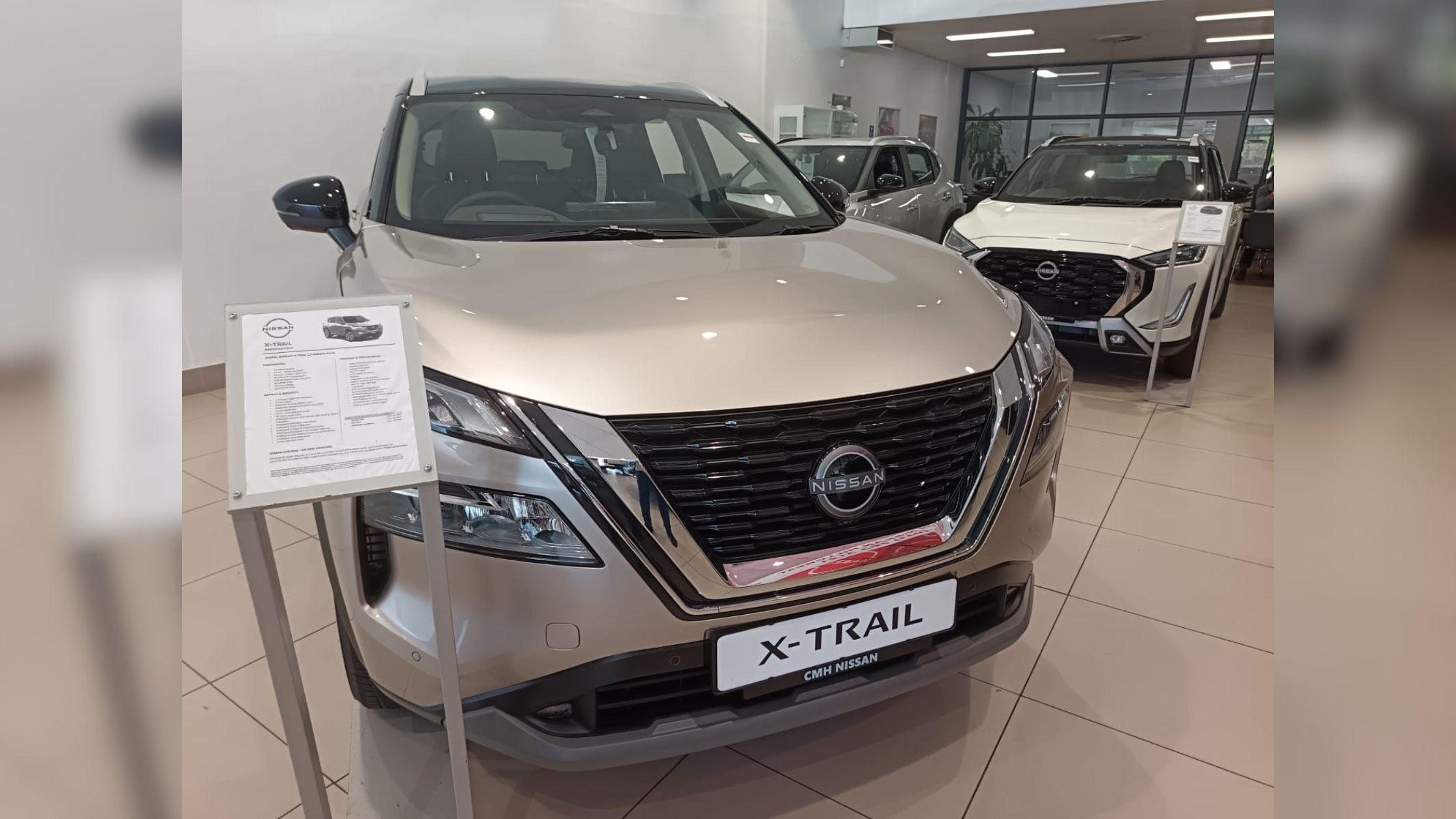 Gold Nissan X-Trail on the showroom